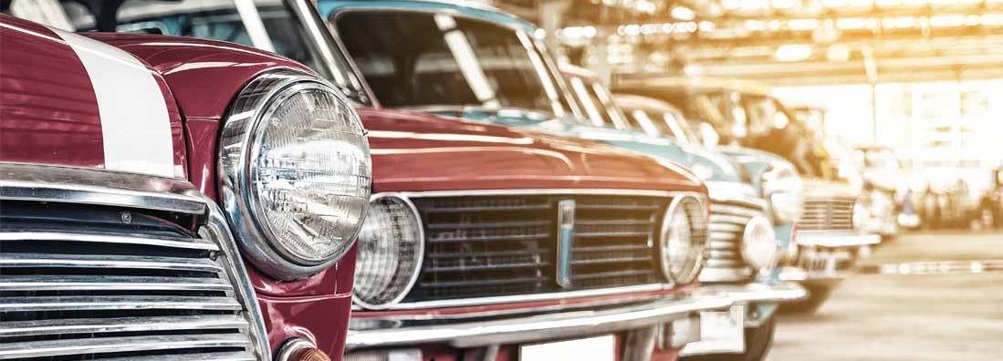 Classic cars in a row parked. Find Collector Car Insurance.