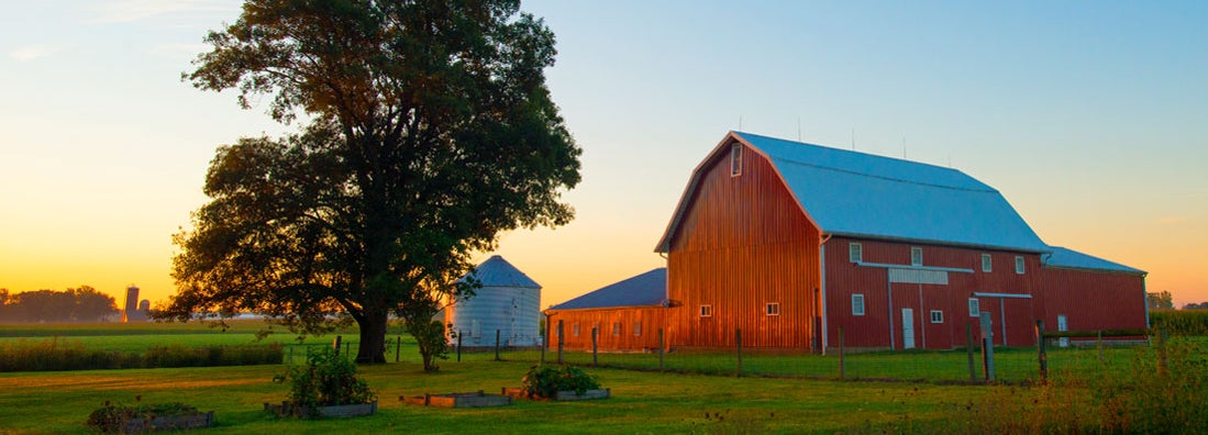 Red Barn at Sunrise. Find farm insurance.
